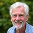 Portrait of David, a mature male gardener smiling.